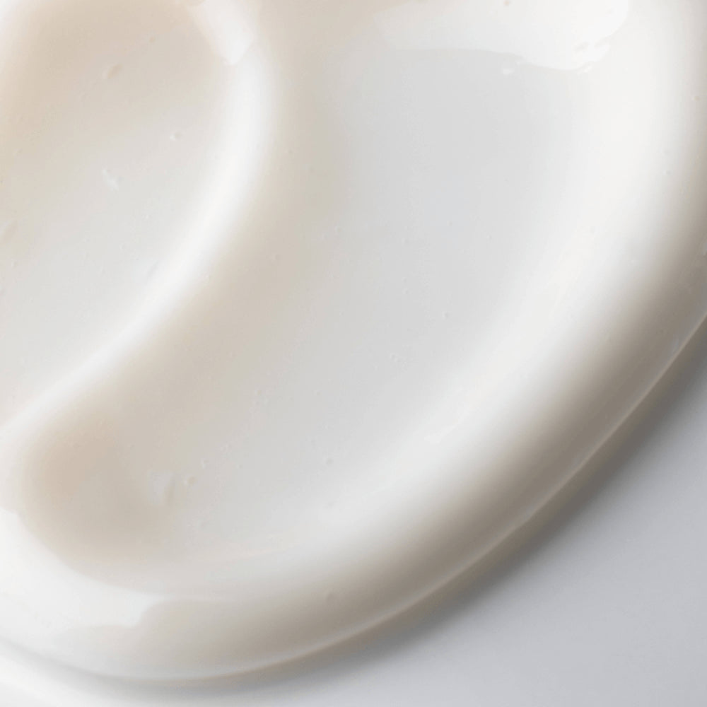 A close-up of Cellcosmet Ultra Sensitive Face Cream swatch with soft shadows and a glossy finish.