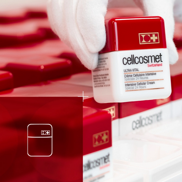 white gloved hand holding Ultra Vital with Ultra Vital jars in background