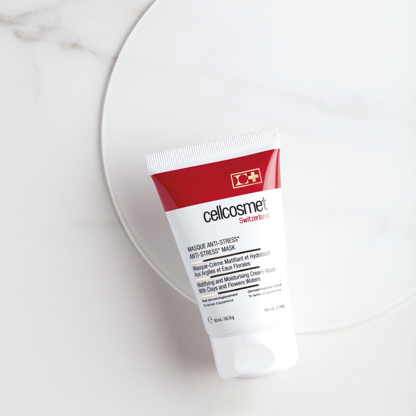 A 60 ml tube of Cellcosmet Anti-Stress Mask displayed on a marble table, highlighting its premium skincare appeal.
