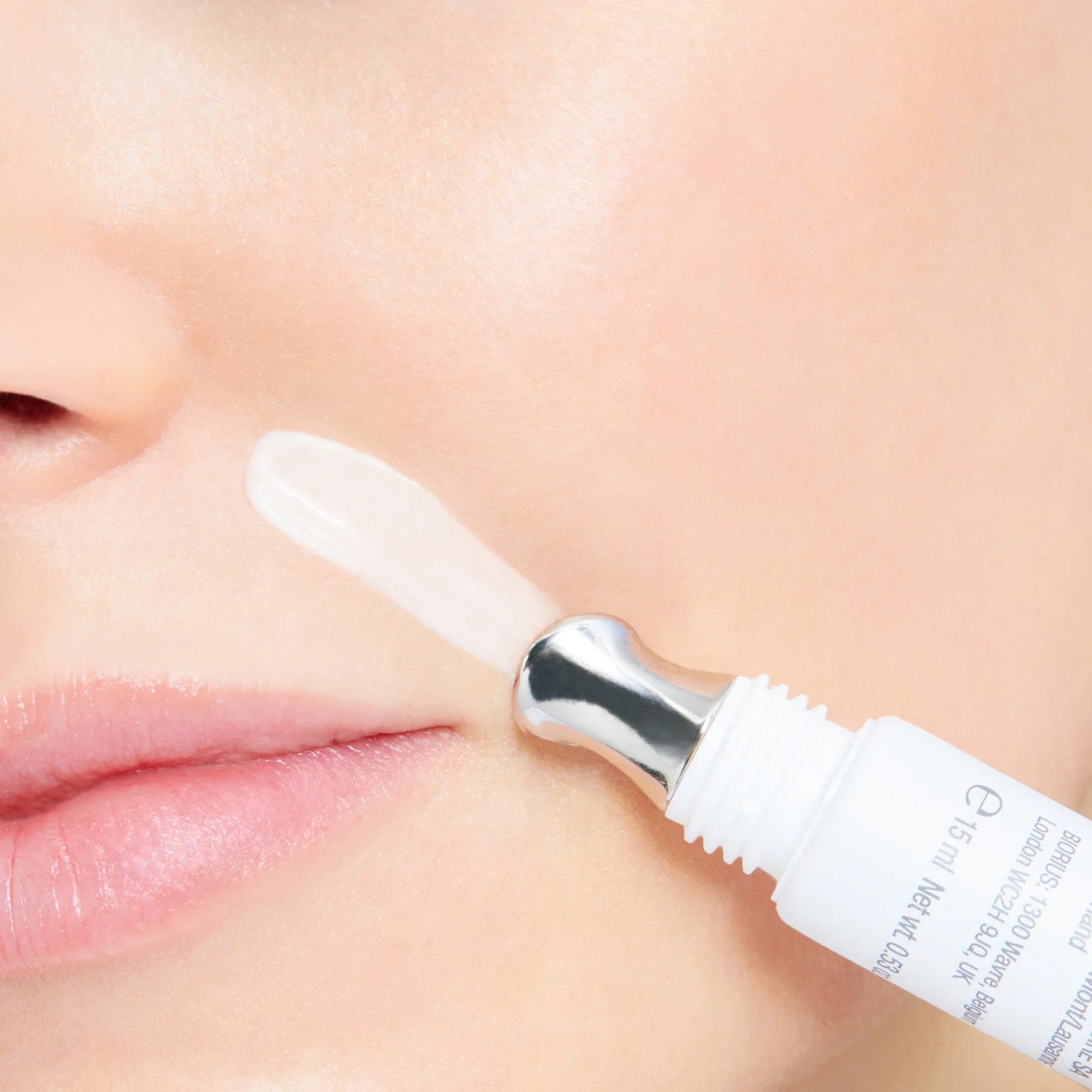 Model applying CellFiller-XT around her laugh lines.