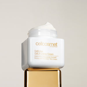 Open jar of CellLift Cream standing on top of its cap.