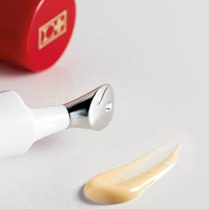 Cellultra Eye Serum_XT on the table with a swatch and opened cap.