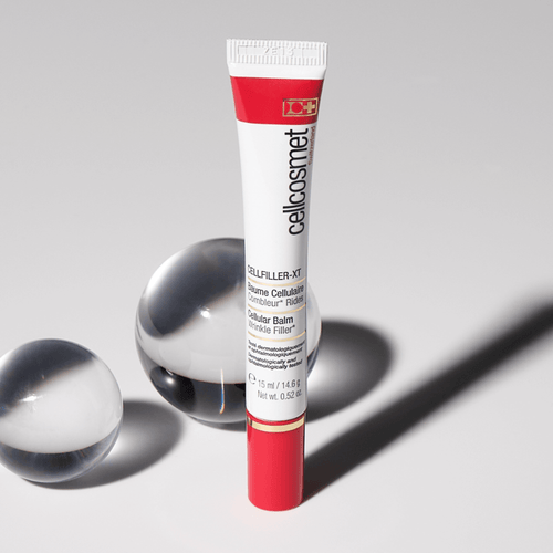 Tube of cellcosmet cellular balm on a gray background