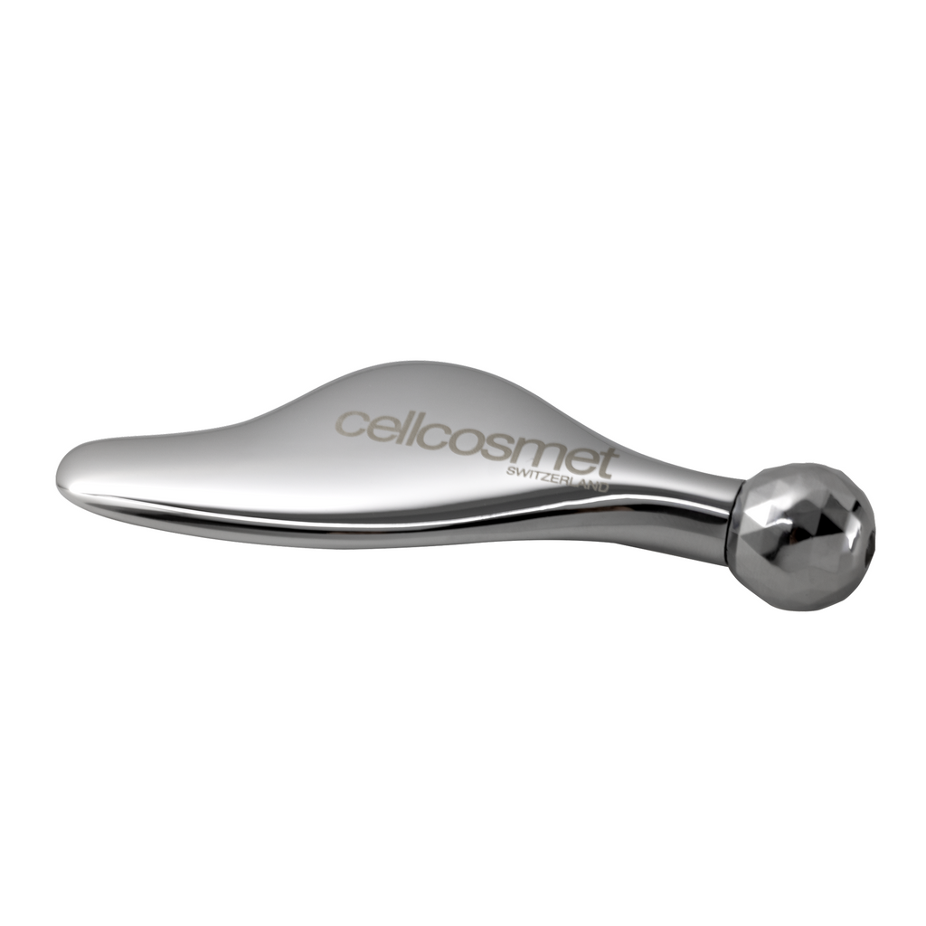 Metallic tool with 'cellcosmet' branding on a white background
