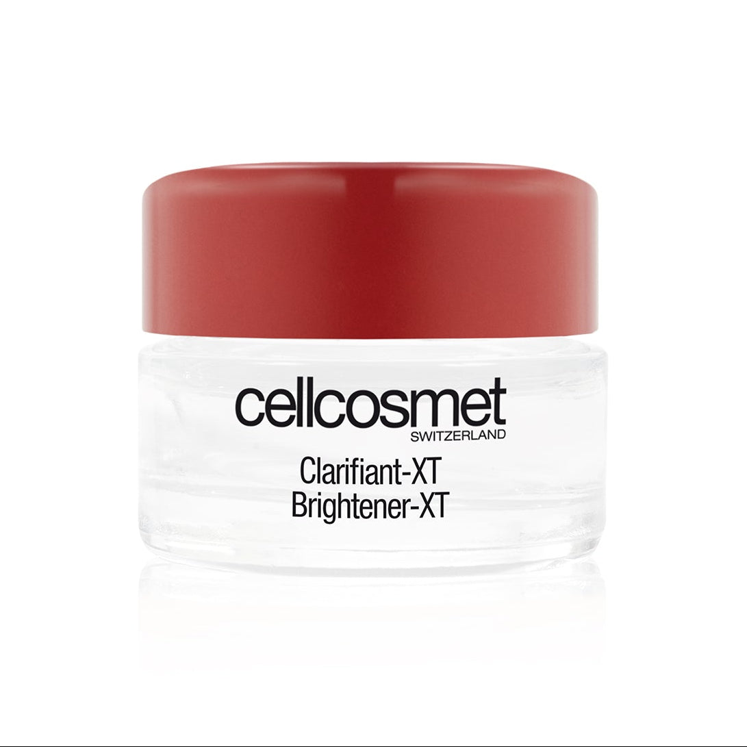 Cosmetic jar with red lid and white body on a white background