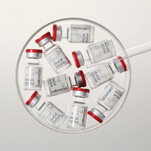Collection of ultracell intensive vials arranged in a circular pattern on a light gray background.